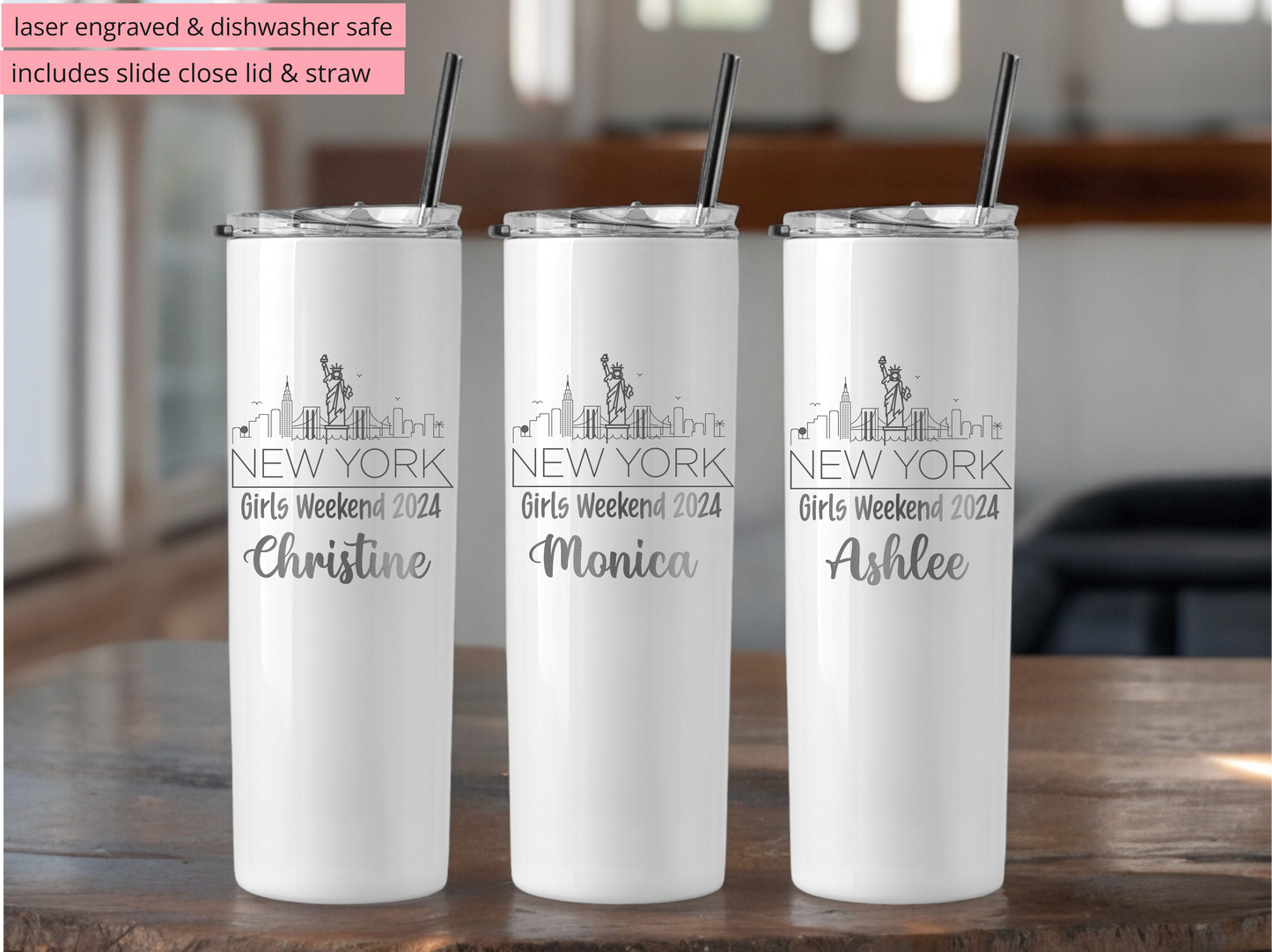 Three white tumblers with personalized names on a wooden table.