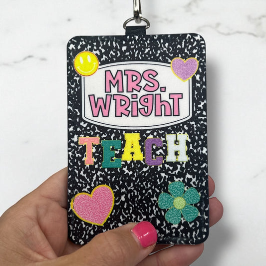 Personalized name tag holder with 'Mrs. Wright Teach' text on a speckled black background.