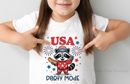 USA Party Mode On Kids Tee – Cute Patriotic Raccoon Graphic on Youth Bella + Canvas Shirt