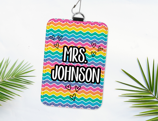 Colorful pouch with 'Mrs. Johnson' text on a white background with green leaves.