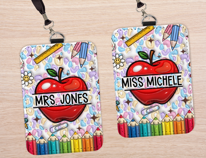 Two colorful name badges with cartoon apples and text 